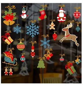 Detail of Christmas window decals featuring Santa, reindeer, and snowflakes for glass decor