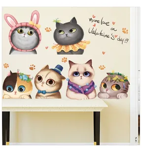 Detail of cute cartoon cat wall stickers with festive accessories for nursery decor