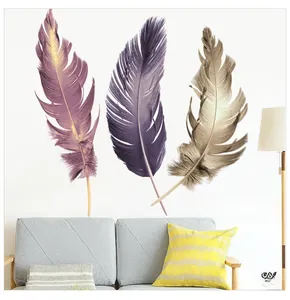 Detail of colorful feather wall stickers in purple and grey tones for living room decor
