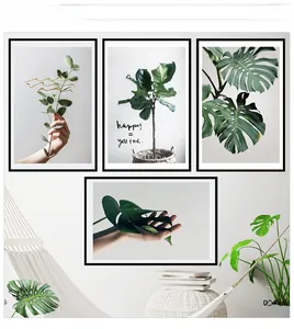 Lot de quatre tableaux de plantes tropicales avec eucalyptus et monstera en cadres noirs