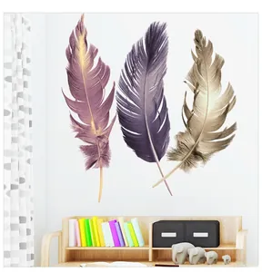 Detailed view of colorful feather wall stickers on a clean white wall with home decor