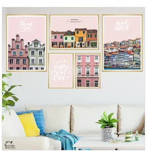 Detail view of five-piece Nordic architectural wall art with brushed gold frames on sofa