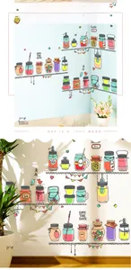 Detail view of colorful mason jar wall decals on light kitchen background