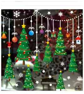 Detailed view of Christmas tree and snowflake window stickers for festive wall decoration