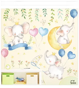 Detail showing watercolor elephant wall decals with moon and stars for nursery decor