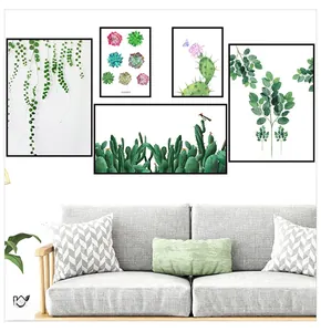 Detailed wall sticker set featuring fresh green plants above a gray fabric sofa