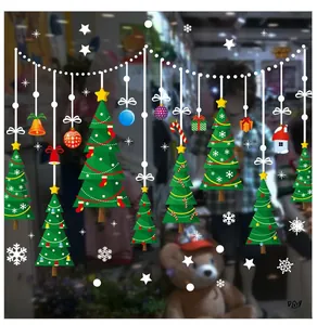 Detail of Christmas window stickers with geometric tree and snowflake designs for shop decor