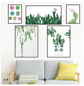 Detailed view of a 5-piece minimalist cactus and succulent wall art set above a gray sofa