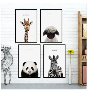 Modern set of four animal canvas wall art featuring giraffe and panda in black frames