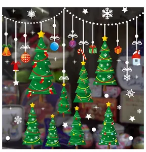 Detailed view of festive Christmas wall stickers with trees, bells and snowflakes