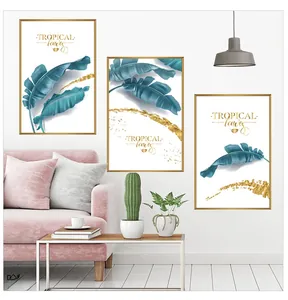 Detail view of modern tropical banana leaves wall art with gold texture and slim frames
