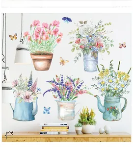 Detailed close-up of watercolor potted flower wall stickers on a clean white wall