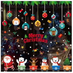 Détail de stickers de Noël pour fenêtres avec Père Noël, rennes et texte festif