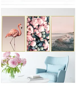Modern triptych wall art featuring pink flamingos and peonies in gold frames