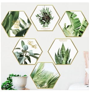 Set of six hexagonal wall art pieces featuring Nordic green plant prints and gold frames