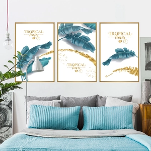 Three-piece set of banana leaf tropical wall art with gold frames for bedroom decor