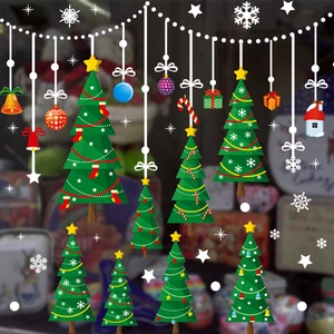 Christmas window stickers featuring green trees, snowflakes, and festive ornaments for decor