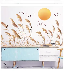 Detail of sunset reed and flying bird wall decal on a modern white living room wall