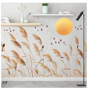 Detailed wall sticker featuring yellow reeds, bird silhouettes and a bright sunset sun