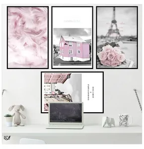 Detail of four pink Nordic wall art frames featuring Eiffel Tower and feather motifs