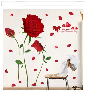 Detail of red rose wall stickers with heart and bow elements on a white bedroom wall