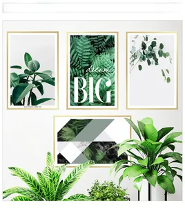 Detail of four-piece tropical green leaf wall art set with metallic frames for living room decor