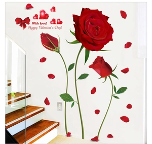 Detail of Happy Valentine's Day wall sticker with red roses and hearts on white wall