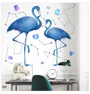 Detail view of starry flamingo wall stickers decorating a cozy home desk setup