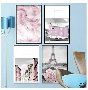 Set of 4 modern pink art frames with black borders on a stylish living room wall