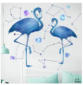 Close-up of flamingo wall decals with starry nebula and constellations in a cozy bedroom