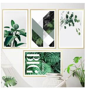 Detailed macro view of four tropical plant wall art prints with golden frames