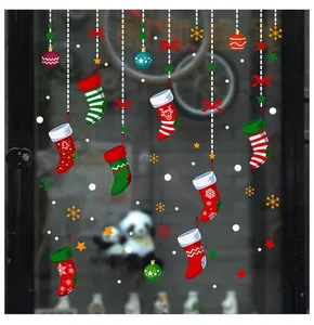 Detail of Christmas stocking window stickers with snowflakes and festive ornaments