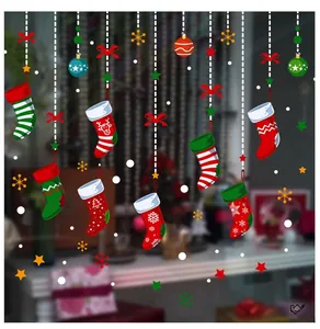 Detailed view of Christmas stocking window decals with colorful snowflake and star patterns