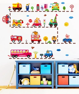 Detailed view of colorful cartoon car wall stickers and animal drivers on white nursery wall