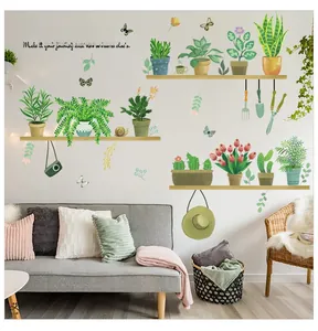 Detail of potted plant wall stickers showing hand-painted botanical art on a living room wall
