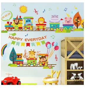 Detail view of colorful cartoon animal train wall stickers on a light blue wall