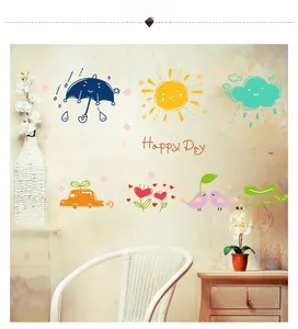 Detailed view of sun, cloud, and umbrella cartoon wall stickers on a textured nursery wall