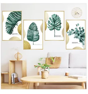 Lot de quatre cadres modernes aux motifs de feuilles tropicales avec bordures dorées