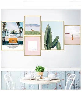 Detail of 5-piece framed wall art set featuring cactus, beach, and deer motifs