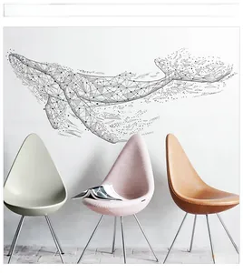 Detailed view of black geometric whale wall decal on a modern white living room wall