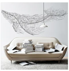 Minimalist black geometric whale wall decal shown in a modern living room setting