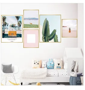 Detailed view of Nordic wall art set featuring cactus and beach motifs in gold frames