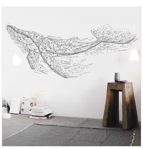Modern geometric black whale wall sticker displayed in a minimalist Nordic living room setup