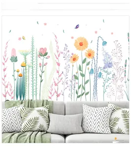 Sticker mural floral avec tournesols et papillons à l'aquarelle sur un mur blanc