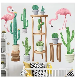 Detail of flamingo and cactus wall stickers in a cozy nursery room setting