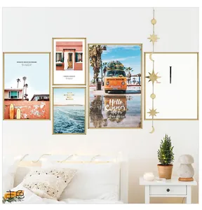Modern wall art set featuring ocean beach prints and metallic moon star hanging ornaments