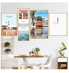 Close-up of five-piece Nordic wall art set featuring beach scenes and gold frames