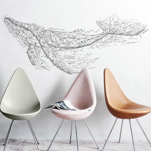 Modern black geometric whale wall sticker in a minimalist living room setting