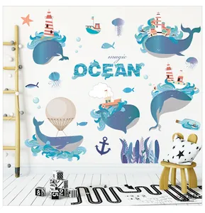Detail of magic ocean wall decals with blue whales and jellyfish on a nursery wall
