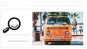 Close-up of yellow vintage surf bus model with surfboards and shark teeth decal